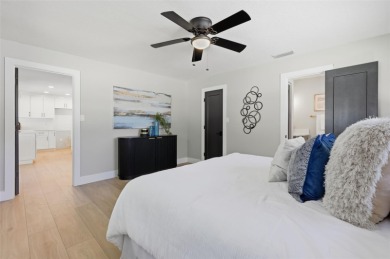 Welcome to this beautifully remodeled 3 bedroom, 2 bathroom pool on Mangrove Bay Golf Course in Florida - for sale on GolfHomes.com, golf home, golf lot