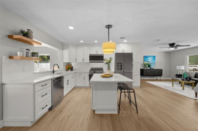 Welcome to this beautifully remodeled 3 bedroom, 2 bathroom pool on Mangrove Bay Golf Course in Florida - for sale on GolfHomes.com, golf home, golf lot