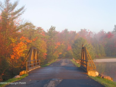 ESCAPE to the Poconos and discover the relaxing lifestyle at on Pinecrest Lake Golf and Country Club in Pennsylvania - for sale on GolfHomes.com, golf home, golf lot