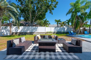 Welcome to this beautifully remodeled 3 bedroom, 2 bathroom pool on Mangrove Bay Golf Course in Florida - for sale on GolfHomes.com, golf home, golf lot