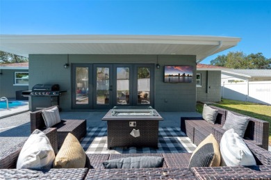 Welcome to this beautifully remodeled 3 bedroom, 2 bathroom pool on Mangrove Bay Golf Course in Florida - for sale on GolfHomes.com, golf home, golf lot