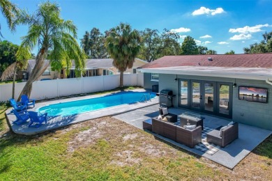 Welcome to this beautifully remodeled 3 bedroom, 2 bathroom pool on Mangrove Bay Golf Course in Florida - for sale on GolfHomes.com, golf home, golf lot
