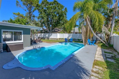 Welcome to this beautifully remodeled 3 bedroom, 2 bathroom pool on Mangrove Bay Golf Course in Florida - for sale on GolfHomes.com, golf home, golf lot