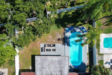 Welcome to this beautifully remodeled 3 bedroom, 2 bathroom pool on Mangrove Bay Golf Course in Florida - for sale on GolfHomes.com, golf home, golf lot