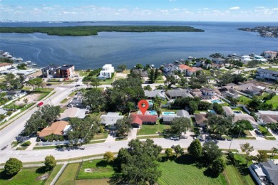 Welcome to this beautifully remodeled 3 bedroom, 2 bathroom pool on Mangrove Bay Golf Course in Florida - for sale on GolfHomes.com, golf home, golf lot