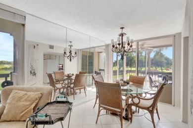 BRIDGEWOOD  2 BED 2 BATH CORNER UNIT. THE VILLAGE OF BRIDGEWOOD on Boca West Golf and Country Club in Florida - for sale on GolfHomes.com, golf home, golf lot