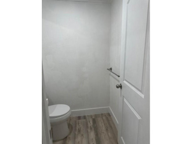 Renovated Waterfront Villa! Freshly painted, vinyl wood flooring on Kings Point Golf -Flanders Way in Florida - for sale on GolfHomes.com, golf home, golf lot