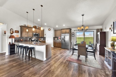 This stunning property offers an 18-ft garage door with an RV on River Bend Golf Course in Idaho - for sale on GolfHomes.com, golf home, golf lot