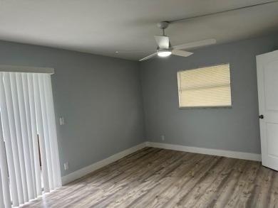 Renovated Waterfront Villa! Freshly painted, vinyl wood flooring on Kings Point Golf -Flanders Way in Florida - for sale on GolfHomes.com, golf home, golf lot
