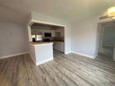 Renovated Waterfront Villa! Freshly painted, vinyl wood flooring on Kings Point Golf -Flanders Way in Florida - for sale on GolfHomes.com, golf home, golf lot