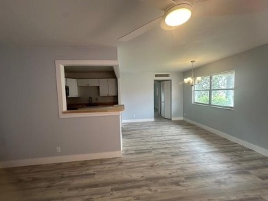 Renovated Waterfront Villa! Freshly painted, vinyl wood flooring on Kings Point Golf -Flanders Way in Florida - for sale on GolfHomes.com, golf home, golf lot