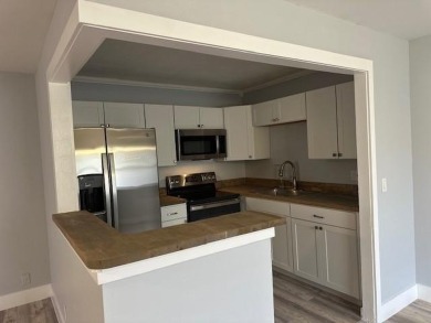 Renovated Waterfront Villa! Freshly painted, vinyl wood flooring on Kings Point Golf -Flanders Way in Florida - for sale on GolfHomes.com, golf home, golf lot