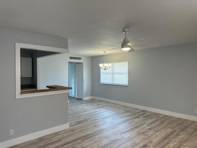 Renovated Waterfront Villa! Freshly painted, vinyl wood flooring on Kings Point Golf -Flanders Way in Florida - for sale on GolfHomes.com, golf home, golf lot