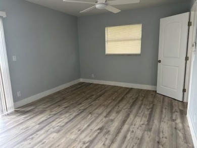 Renovated Waterfront Villa! Freshly painted, vinyl wood flooring on Kings Point Golf -Flanders Way in Florida - for sale on GolfHomes.com, golf home, golf lot