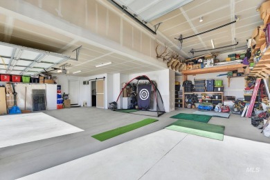 This stunning property offers an 18-ft garage door with an RV on River Bend Golf Course in Idaho - for sale on GolfHomes.com, golf home, golf lot