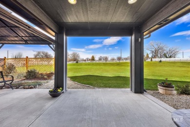 This stunning property offers an 18-ft garage door with an RV on River Bend Golf Course in Idaho - for sale on GolfHomes.com, golf home, golf lot