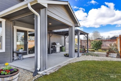 This stunning property offers an 18-ft garage door with an RV on River Bend Golf Course in Idaho - for sale on GolfHomes.com, golf home, golf lot