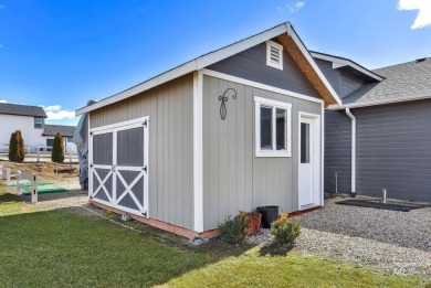 This stunning property offers an 18-ft garage door with an RV on River Bend Golf Course in Idaho - for sale on GolfHomes.com, golf home, golf lot