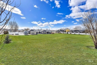 This stunning property offers an 18-ft garage door with an RV on River Bend Golf Course in Idaho - for sale on GolfHomes.com, golf home, golf lot