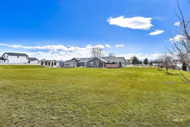 This stunning property offers an 18-ft garage door with an RV on River Bend Golf Course in Idaho - for sale on GolfHomes.com, golf home, golf lot