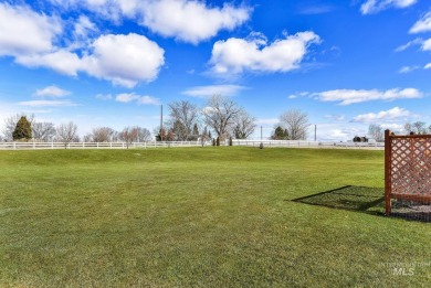 This stunning property offers an 18-ft garage door with an RV on River Bend Golf Course in Idaho - for sale on GolfHomes.com, golf home, golf lot