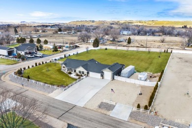 This stunning property offers an 18-ft garage door with an RV on River Bend Golf Course in Idaho - for sale on GolfHomes.com, golf home, golf lot