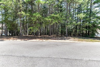 Beautiful, Waterview, level, wooded lot located in the gated on Trump National Golf Club Charlotte in North Carolina - for sale on GolfHomes.com, golf home, golf lot