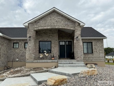 Spiral piers are the focal point of the double door grand entry on Teton Lakes Golf Courses in Idaho - for sale on GolfHomes.com, golf home, golf lot