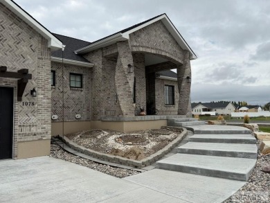 Spiral piers are the focal point of the double door grand entry on Teton Lakes Golf Courses in Idaho - for sale on GolfHomes.com, golf home, golf lot