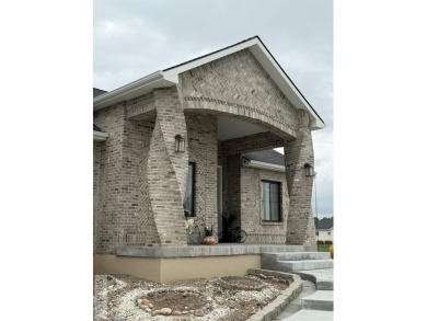 Spiral piers are the focal point of the double door grand entry on Teton Lakes Golf Courses in Idaho - for sale on GolfHomes.com, golf home, golf lot