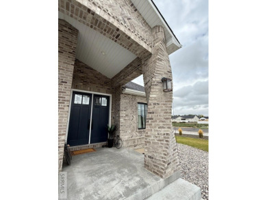 Spiral piers are the focal point of the double door grand entry on Teton Lakes Golf Courses in Idaho - for sale on GolfHomes.com, golf home, golf lot