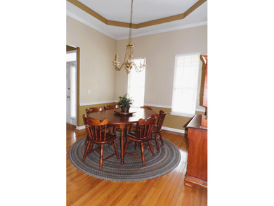 Nestled on the second tee of a premier golf course, this on Legend Oaks Plantation Golf Club in South Carolina - for sale on GolfHomes.com, golf home, golf lot