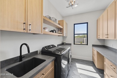 Built in 2021 on 1.73 acres, this contemporary retreat is on Desert Highlands Golf Club in Arizona - for sale on GolfHomes.com, golf home, golf lot