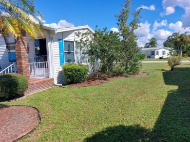 Beautiful Corner Lot partially furnished home with 2 bedrooms, 2 on Pine Lakes Country Club in Florida - for sale on GolfHomes.com, golf home, golf lot