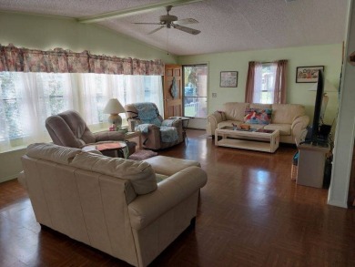 Beautiful Corner Lot partially furnished home with 2 bedrooms, 2 on Pine Lakes Country Club in Florida - for sale on GolfHomes.com, golf home, golf lot