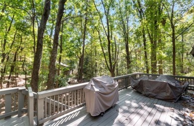 This is a light and bright, fully renovated, real log cabin in on Big Canoe Golf Club - Cherokee in Georgia - for sale on GolfHomes.com, golf home, golf lot