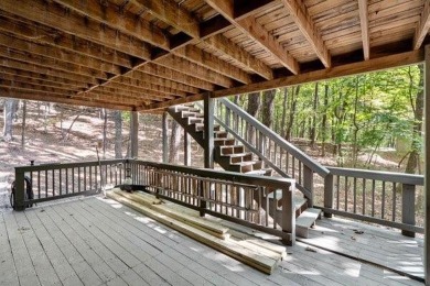 This is a light and bright, fully renovated, real log cabin in on Big Canoe Golf Club - Cherokee in Georgia - for sale on GolfHomes.com, golf home, golf lot