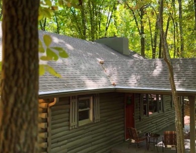 This is a light and bright, fully renovated, real log cabin in on Big Canoe Golf Club - Cherokee in Georgia - for sale on GolfHomes.com, golf home, golf lot