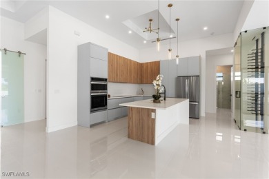 Experience REFINED LIVING in this MODERN LUXURY RESIDENCE in on Palmetto-Pine Country Club in Florida - for sale on GolfHomes.com, golf home, golf lot