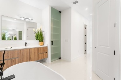 Experience REFINED LIVING in this MODERN LUXURY RESIDENCE in on Palmetto-Pine Country Club in Florida - for sale on GolfHomes.com, golf home, golf lot