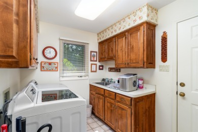 Charming 3-bedroom, 2.5-bath home on a corner lot overlooking on Balboa Golf Course in Arkansas - for sale on GolfHomes.com, golf home, golf lot