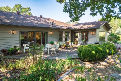 Charming 3-bedroom, 2.5-bath home on a corner lot overlooking on Balboa Golf Course in Arkansas - for sale on GolfHomes.com, golf home, golf lot