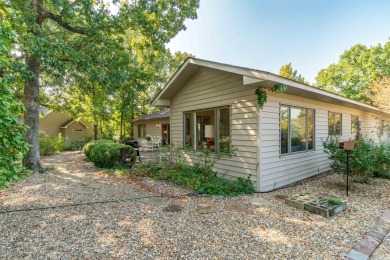 Charming 3-bedroom, 2.5-bath home on a corner lot overlooking on Balboa Golf Course in Arkansas - for sale on GolfHomes.com, golf home, golf lot