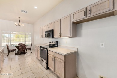 Live on the 18th green of Coyote Lakes in this bright, inviting on Coyote Lakes Golf Club in Arizona - for sale on GolfHomes.com, golf home, golf lot