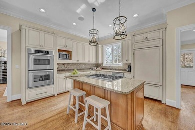 Perfectly situated on the Nicklaus #9 green with tranquil pond on Country Club of Landfall in North Carolina - for sale on GolfHomes.com, golf home, golf lot