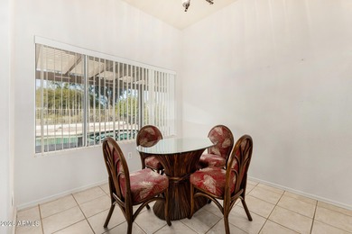 Live on the 18th green of Coyote Lakes in this bright, inviting on Coyote Lakes Golf Club in Arizona - for sale on GolfHomes.com, golf home, golf lot