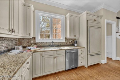 Perfectly situated on the Nicklaus #9 green with tranquil pond on Country Club of Landfall in North Carolina - for sale on GolfHomes.com, golf home, golf lot