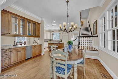 Perfectly situated on the Nicklaus #9 green with tranquil pond on Country Club of Landfall in North Carolina - for sale on GolfHomes.com, golf home, golf lot