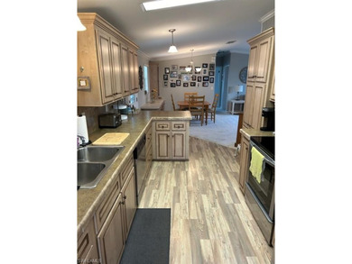 This 2008 Jacobson manufactured home is located on one of the on Pelicans Nest Golf Club in Florida - for sale on GolfHomes.com, golf home, golf lot