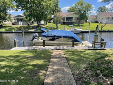 This waterfront resort home offers a lifestyle immersed in on Harbour Point Golf Club in North Carolina - for sale on GolfHomes.com, golf home, golf lot